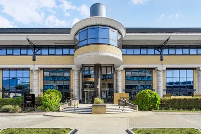 Main entrance of Vonder Skies with its curved glass frontage