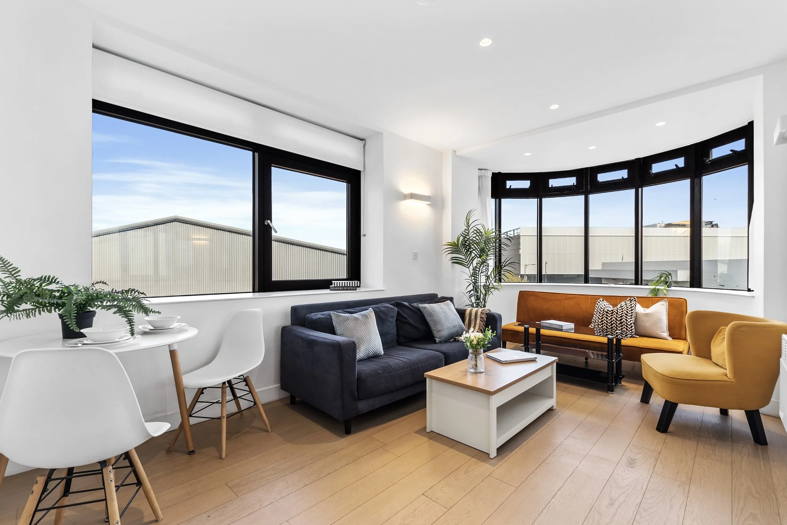 Open-plan living and dining area of a two-bedroom apartment at Vonder Skies