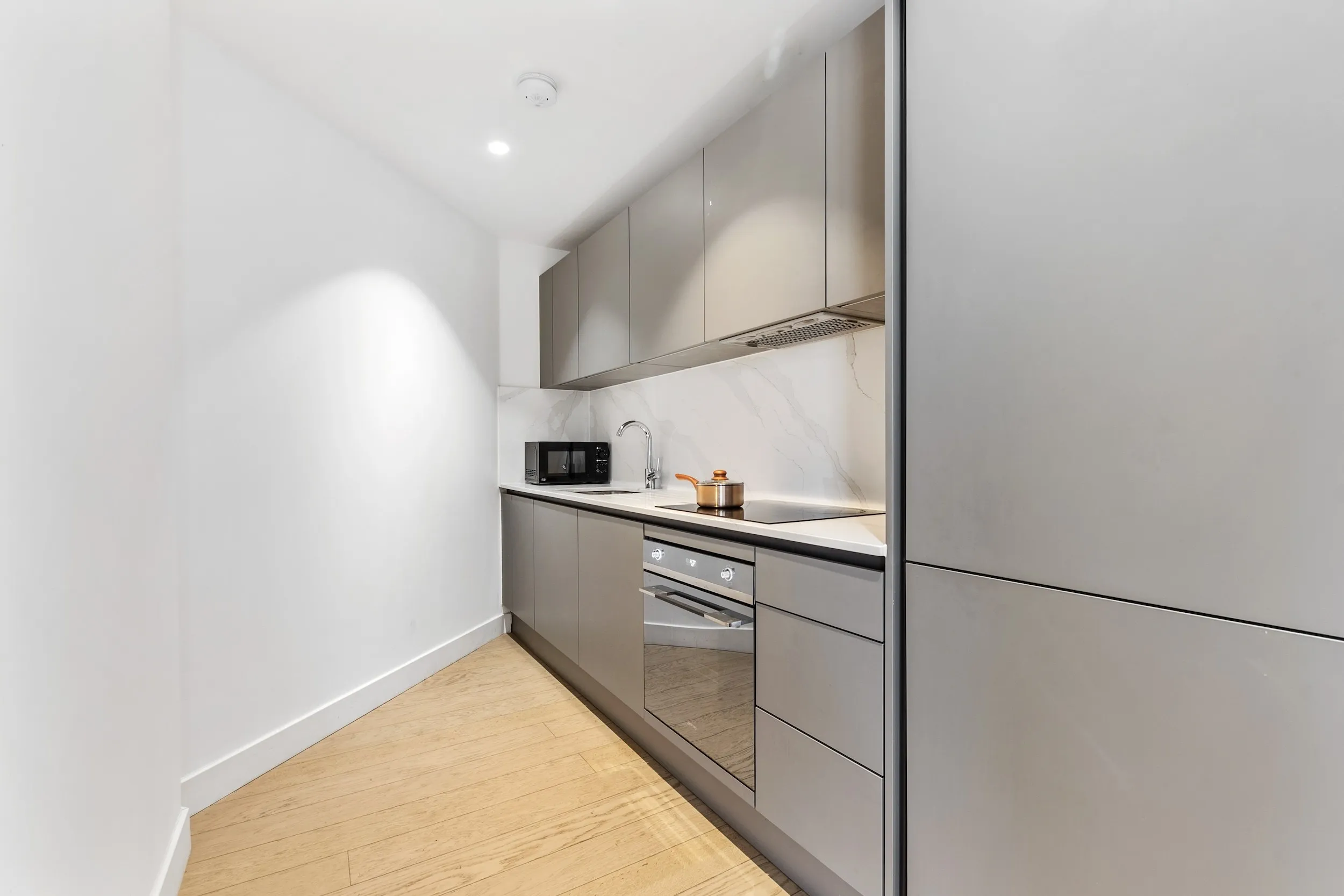 Kitchen with integrated appliances at Vonder Skies