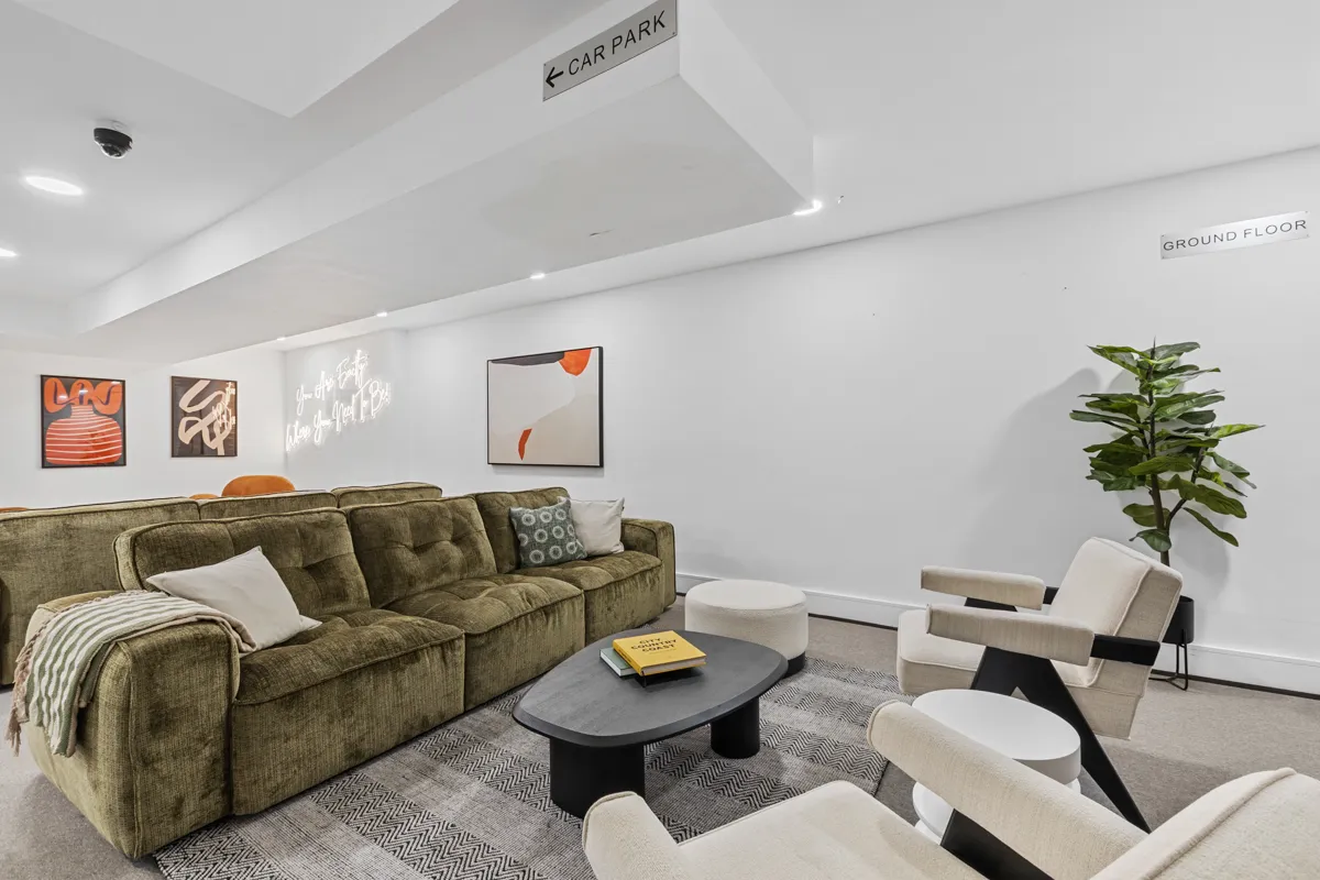 Velvet sofas in the lounge at Vonder Akron House