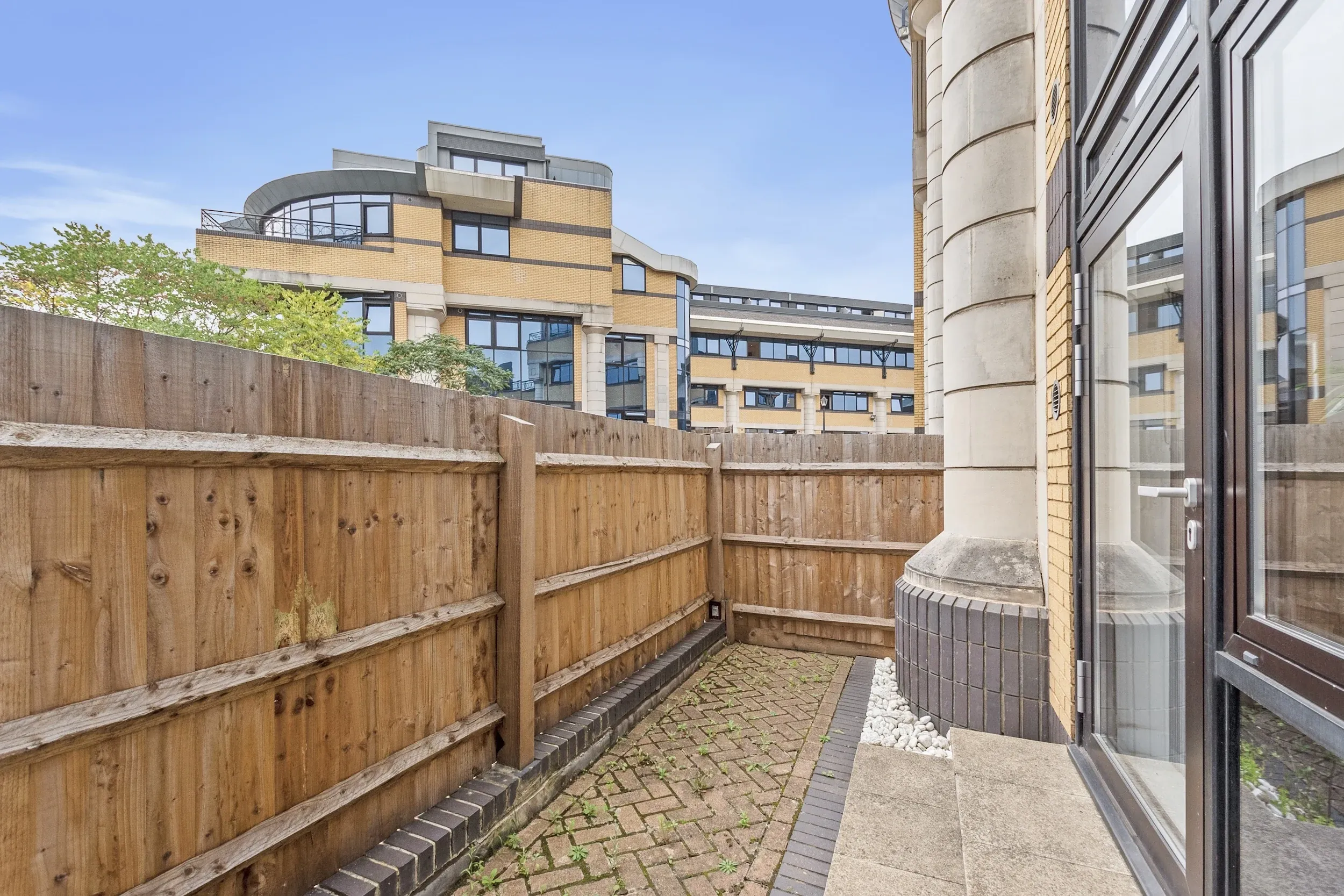 Private patio outside a ground-floor studio at Vonder Akron House