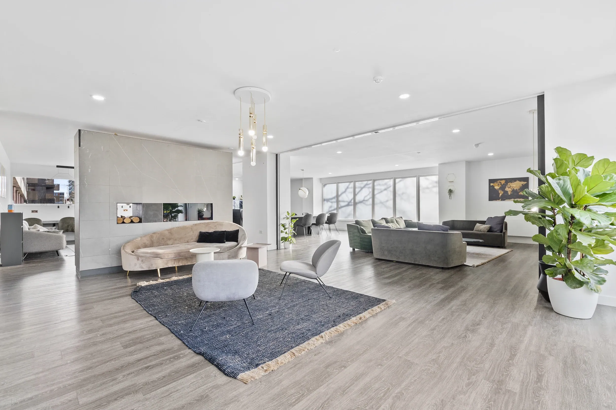 Lounge at Vonder Crawley, with pale sofas and a dining area beyond