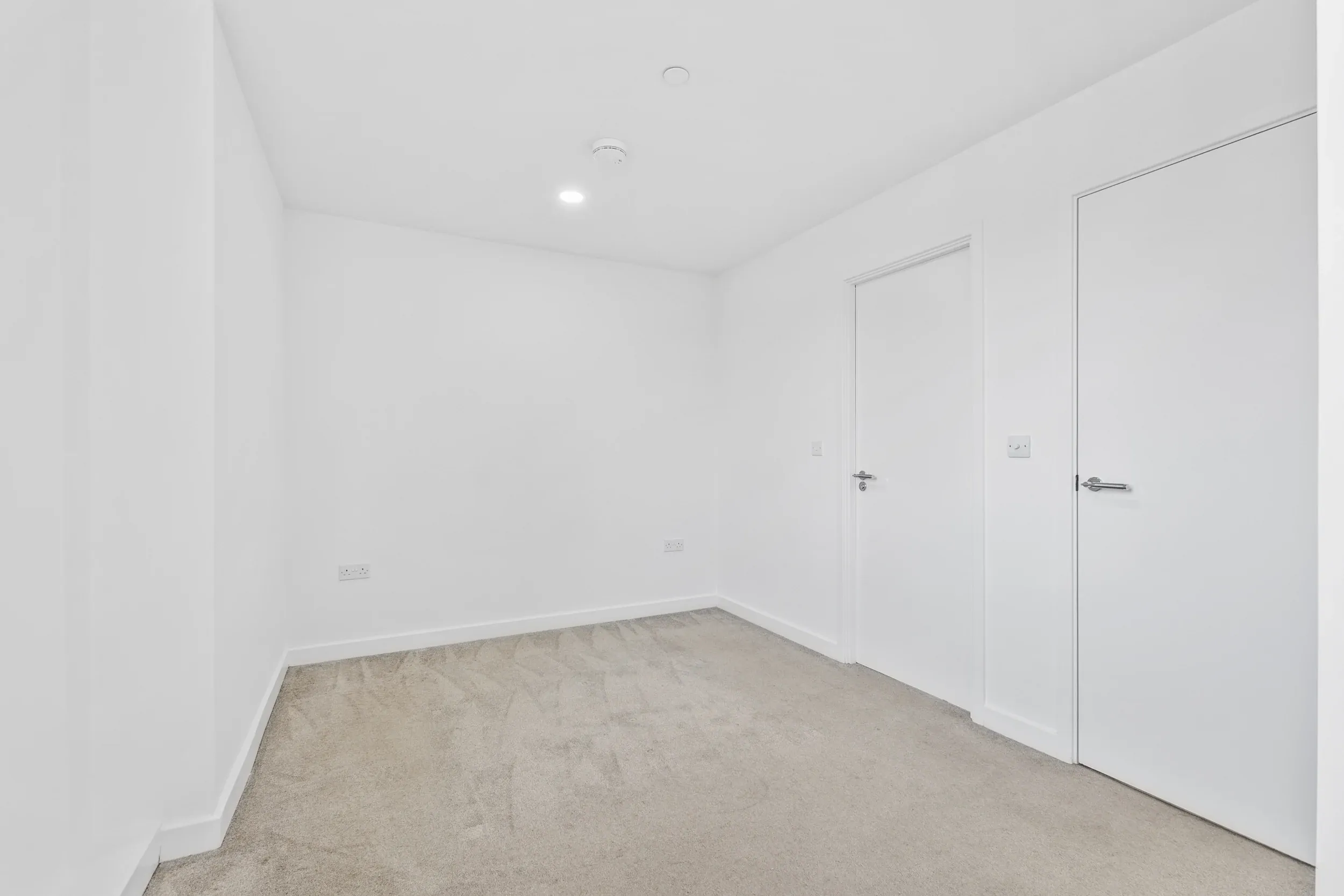 Bedroom in a two-bedroom flat at Vonder Crawley, shown unfurnished