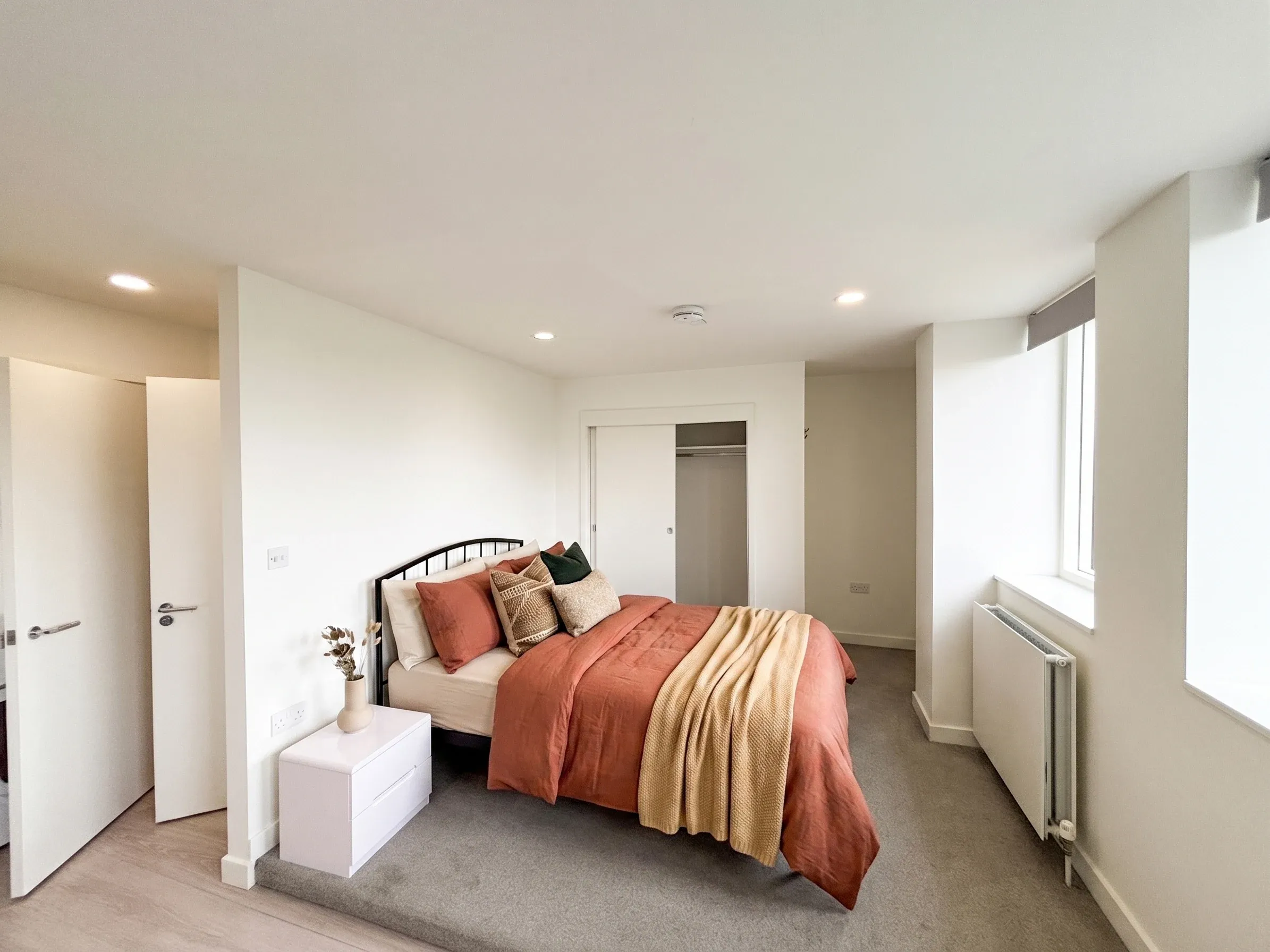 Sleeping area in a studio flat at Vonder Crawley, beside a window