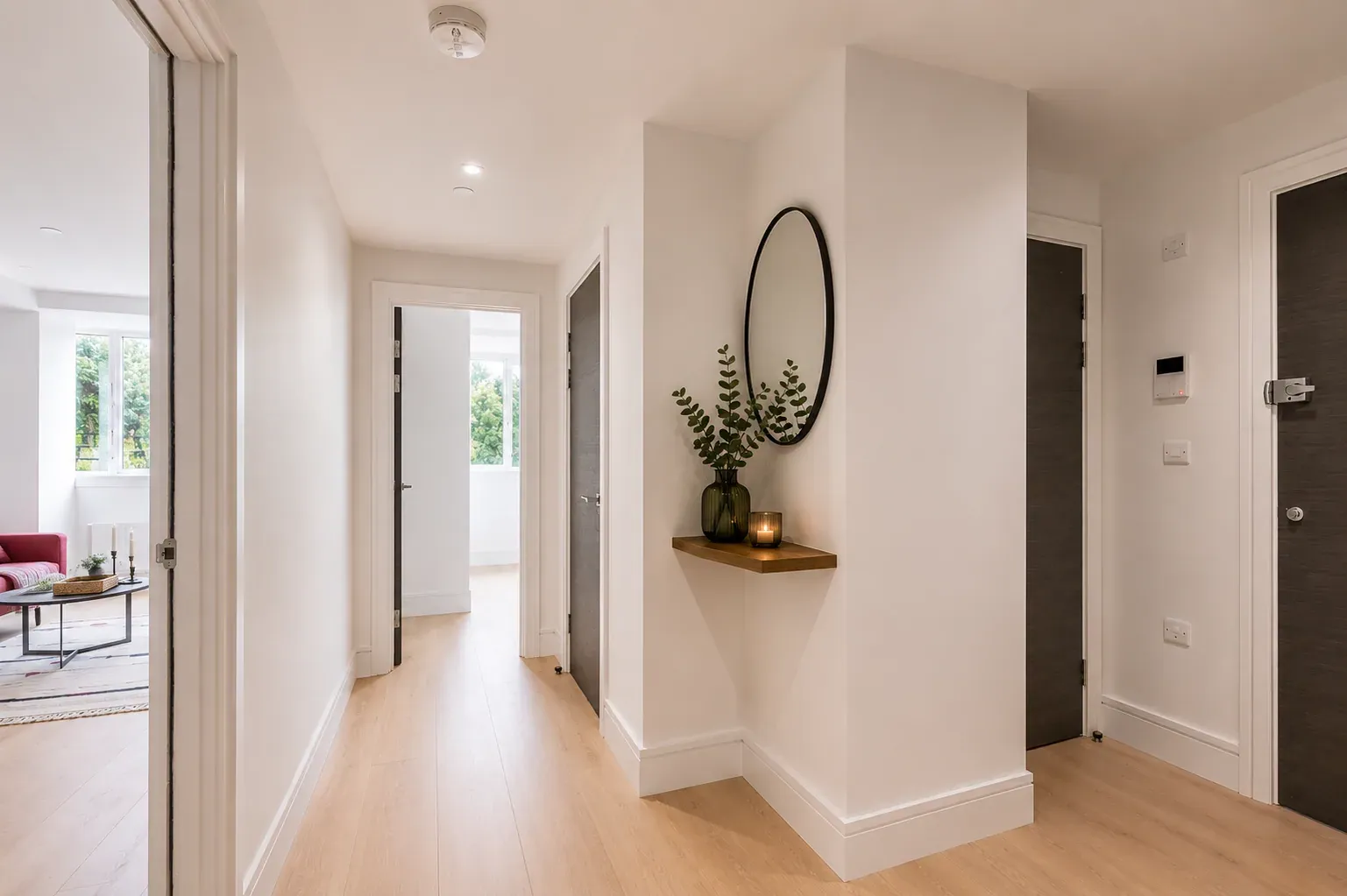 Hallway looking through to the living room and bedroom in a one-bedroom flat at Vonder Wembley