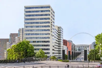 The Vonder Wembley building on Olympic Way, with Wembley Stadium and its arch in the background